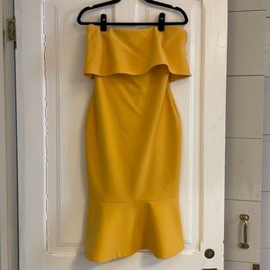 Likely yellow/gold strapless dress